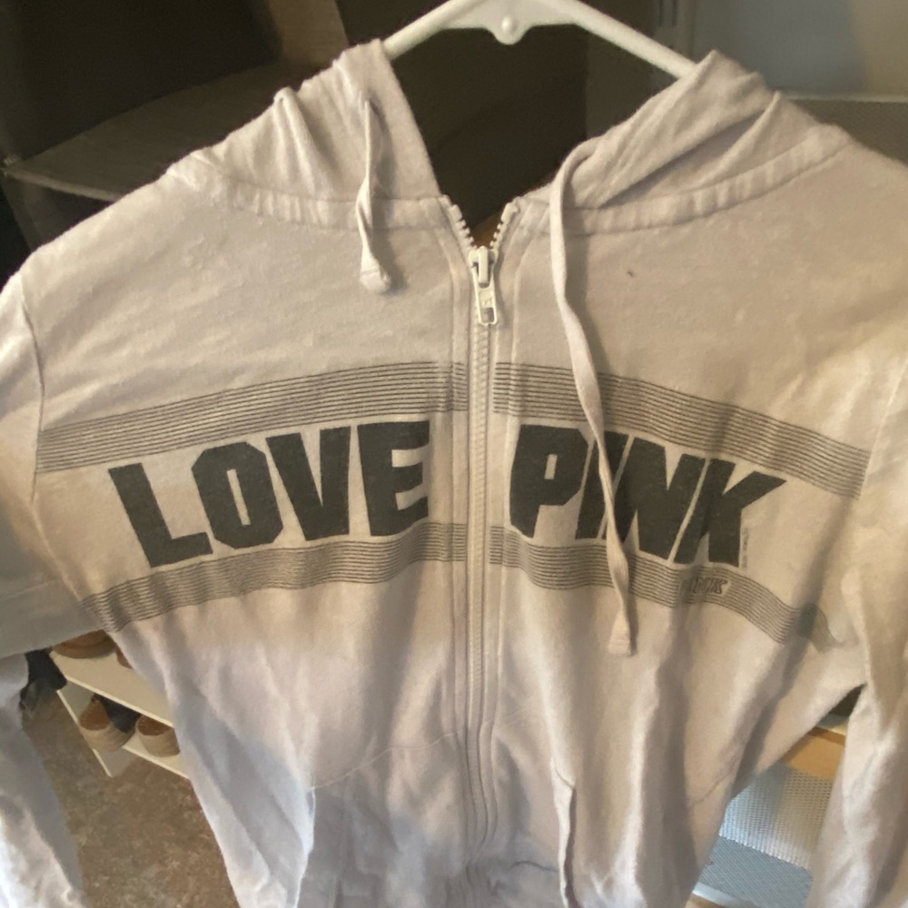 pink zip up sweatshirt, says size xs fits a M
